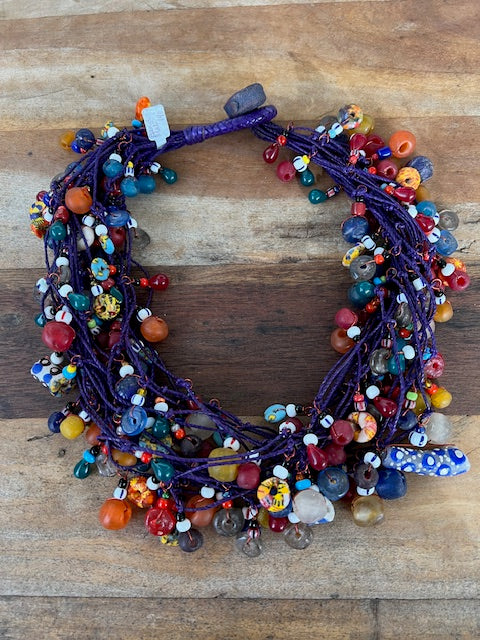 Multi-Strand Glass Trade Beads on Purple Leather
