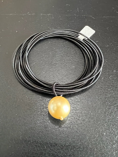 Black Piano Wire Bracelet with Gold Pearl