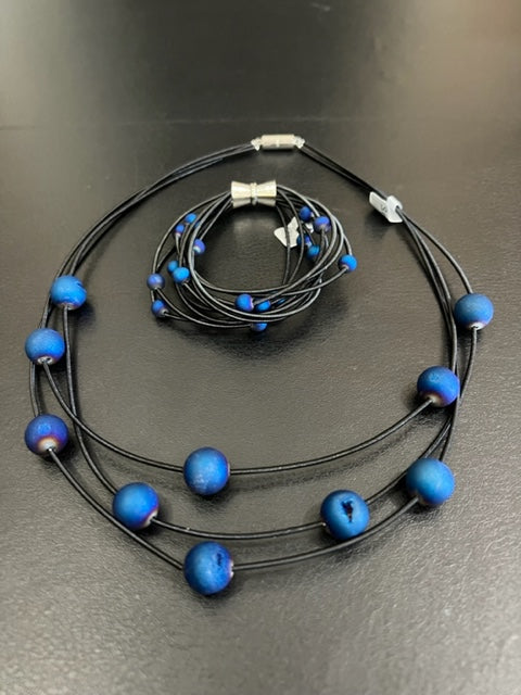 Black 3-Strand Piano Wire Necklace with Layered Blue Geodes