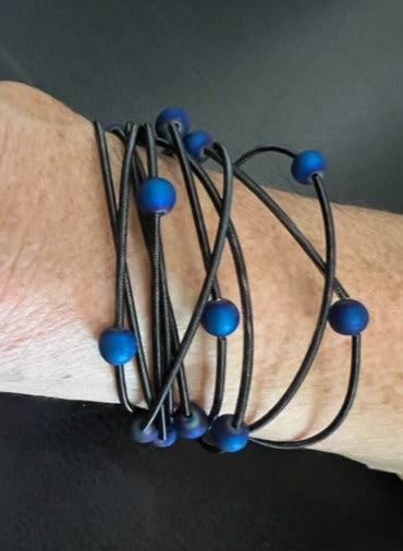 Black 10-Strand Piano Wire Bracelet with Blue Geodes